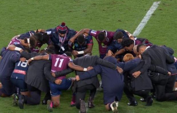 Rebels and Reds prayer circle